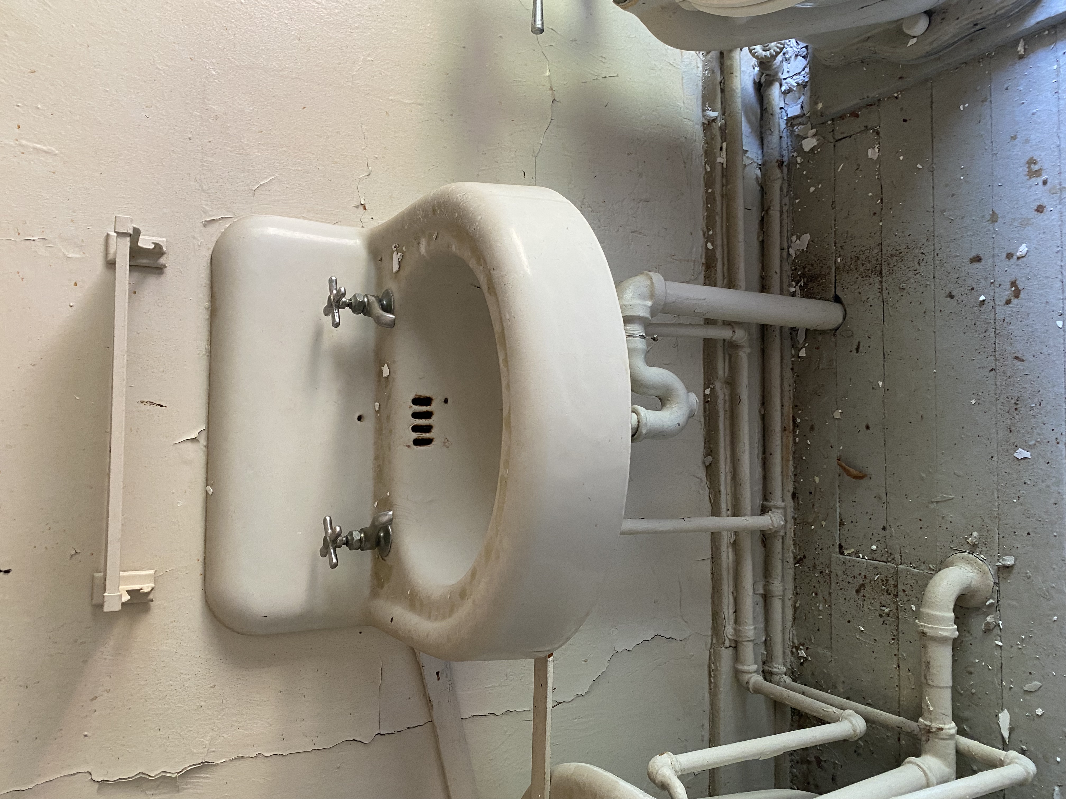 Rounded wall-mounted Sink from renovation of Historic Officer's Home on Governors Island