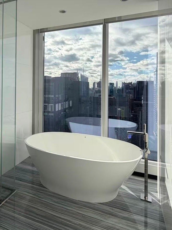 MTI Collection SculptureStone® Alissa Freestanding Bathtub + Dornbracht Tub Filler