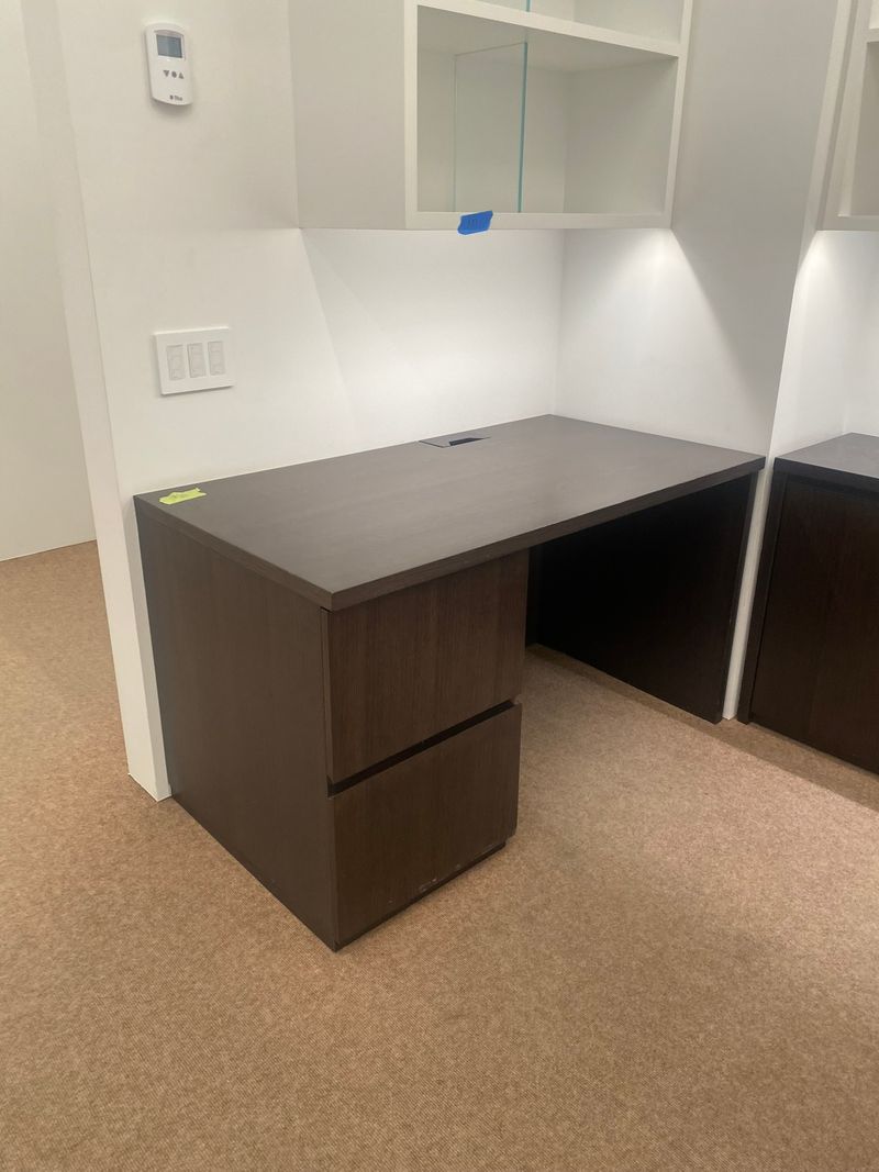 Dark brown wooden desk with drawers